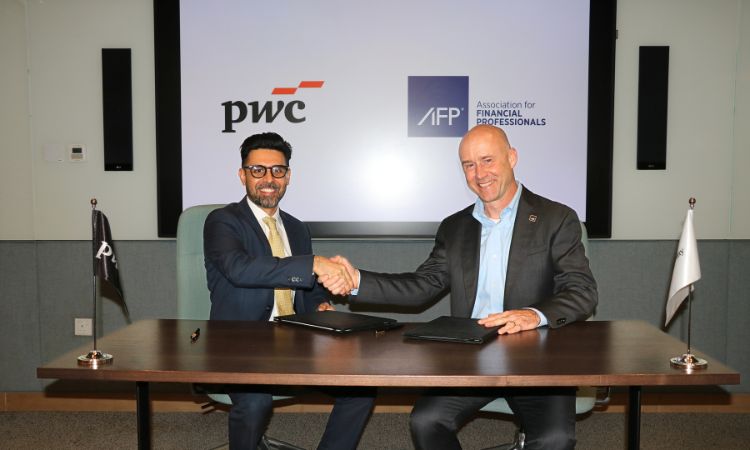 AFP President & CEO and PwC representative shaking hands