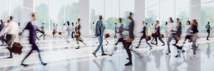 Crowd of businesspeople walking